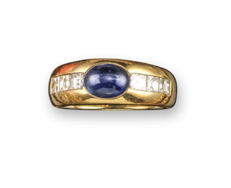 A sapphire and diamond bombe ring by Cartier, centred with a cabochon sapphire with square-shaped diamonds to the shoulders i