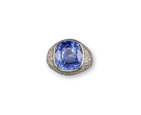 A French sapphire and diamond bombe ring, the cushion-shaped sapphire weighs 16.88cts, set in raised surround pave-set with d