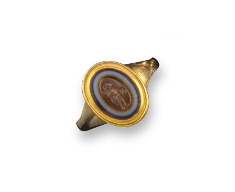 A Roman sardonyx intaglio depicting Mercury, c2nd century AD, the figure standing with caduceus and purse, in an 18th-19th ce