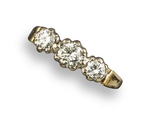 A diamond three-stone ring, the three round brilliant-cut diamonds are set in platinum and gold, size M