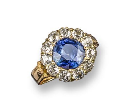 A 19th century sapphire and diamond cluster ring, centred with an old circular-cut sapphire within a surround of old circular