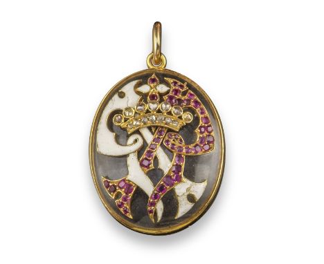 An early 20th century gold-mounted oval-shaped locket pendant, the hinged cover mounted with a diamond-set coronet over a pai