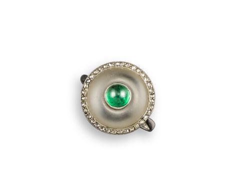 A emerald and rock crystal target ring, set with a cabochon emerald within rock crystal and diamond border in platinum, size 