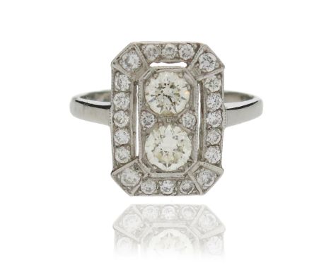 A diamond cluster ring, centred with two circular-cut diamonds within a rectangular openwork surround set with further circul