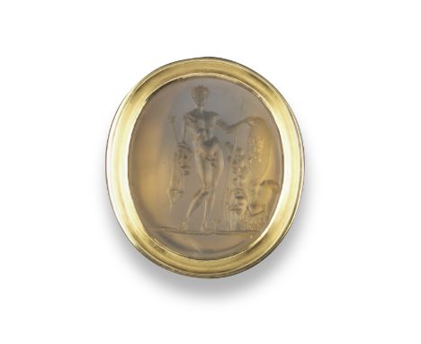 A late 18th / early 19th century chalcedony intaglio depicting a standing Mars, with assorted weapons and armour, in a gold r