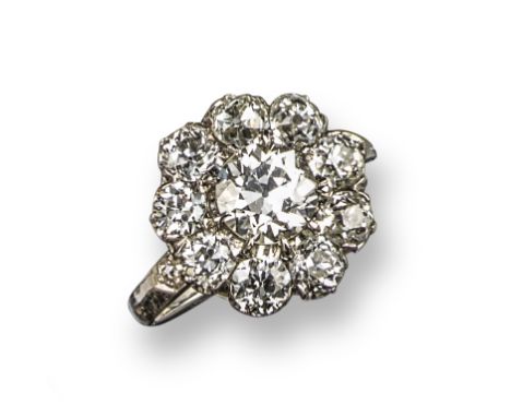 A diamond cluster ring, set with old circular-cut diamonds in platinum, size N