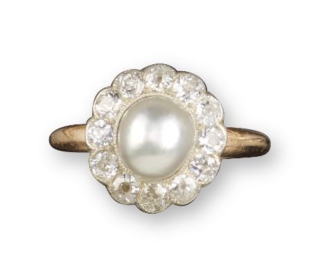 A pearl and diamond cluster ring, the pearl set within a surround of old cushion-shaped diamonds in platinum and gold closed-