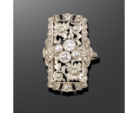 An Art Deco foliate plaque ring, set with old circular and rose-cut diamonds, with black enamel decoration in platinum and wh