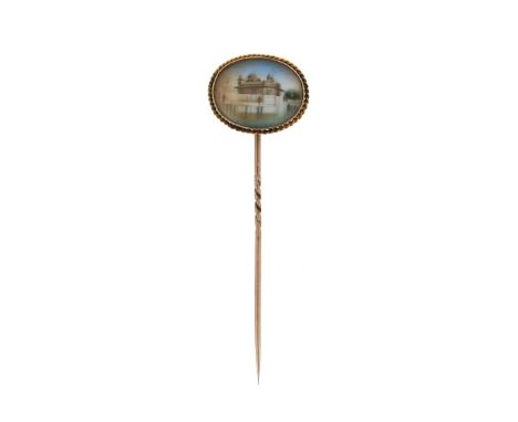 An Indian miniature painting mounted gold stick pin, set within yellow gold ropetwist border, 2.3cm wide, in a stickpin box b