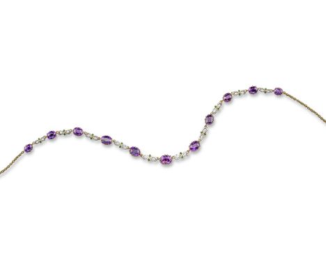 An early 20th century amethyst-set gold necklace, in the suffragette colours, alternately-set with oval-shaped amethysts and 