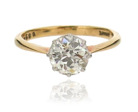 A diamond solitaire ring, the old cushion-shaped diamond weighs approximately 1.45cts, set in platinum and yellow gold mount,