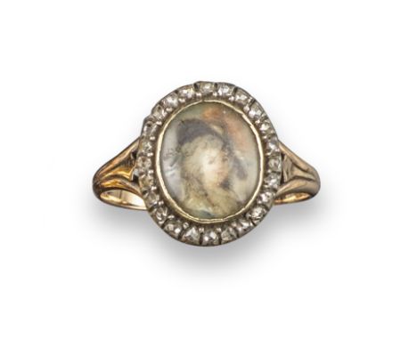 A George III diamond portrait ring, of oval form with diamond-set border in closed-back silver and gold mount, size N, in sil