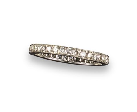 A diamond eternity ring, set with round brilliant-cut diamonds in platinum, size O