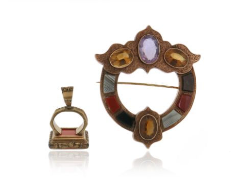 A Scottish gold gem-set brooch, the Celtic design set with carved banded agates, and faceted citrines and an amethyst in carv