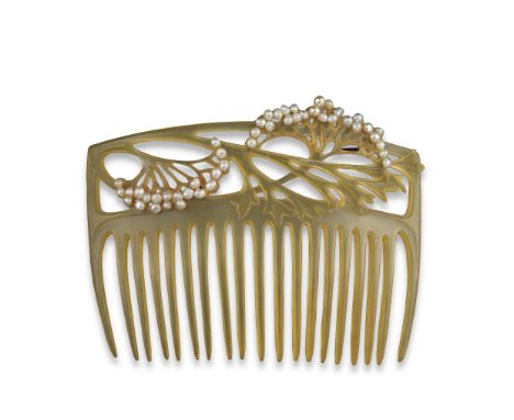 λ An Art Nouveau tortoiseshell comb, in the style of Louis Aucoc, the pierced foliate upper section with s pearl highlights, 