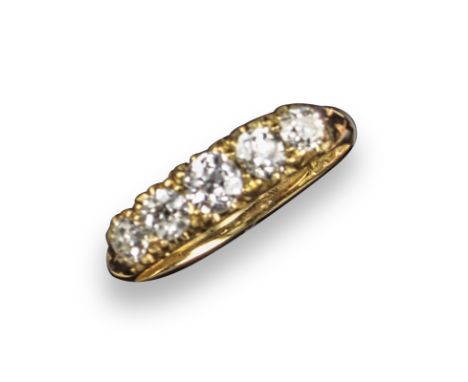 A Victorian diamond five-stone ring, set with graduated old circular-cut diamonds in carved and pierced yellow gold mount, si