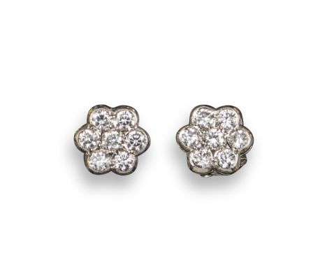 A pair of diamond cluster earrings, of flowerhead design, set with round brilliant-cut diamonds in white gold, post fittings,