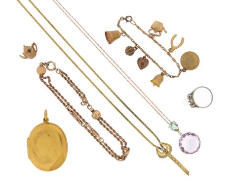 A mixed group of jewellery, including a Victorian gold locket pendant, a diamond three stone ring (one stone loose from mount