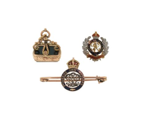 A Regimental brooch for The Royal Engineers, decorated with enamel and diamonds in yellow gold, with another Regimental brooc