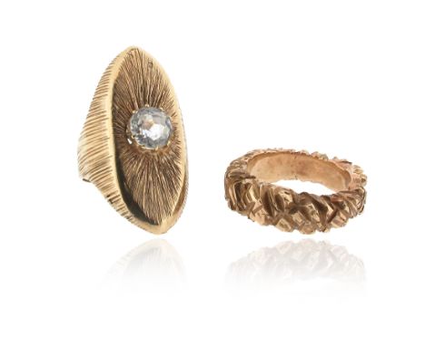 Two gold rings, one navette-shaped gold ring with carved decoration and centred with a circular-cut white sapphire, size N, t