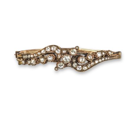 A 19th century diamond bangle, of scroll form and set overall with graduated rose-cut diamonds in yellow gold, 5.7cm inner di