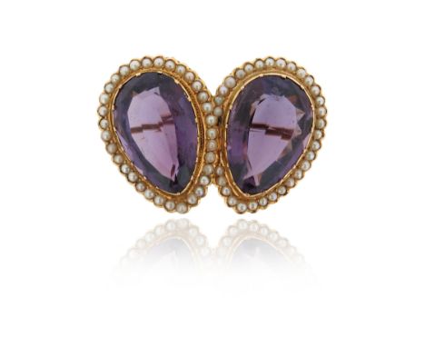 A Victorian amethyst and seed pearl brooch, set with two pear-shaped amethysts within seed pearl surround in yellow gold, 4.1