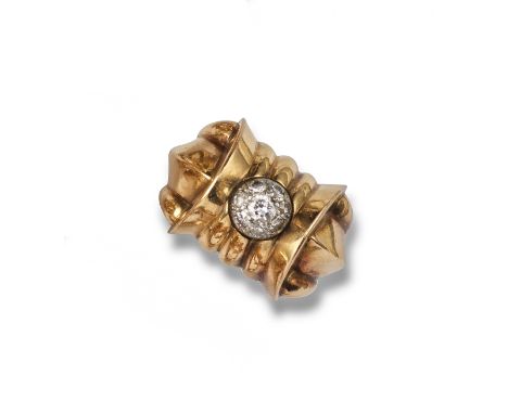 A diamond-set gold Odeonesque ring, c1940, the domed centre is pave-set with circular-cut diamonds within a gold fluted surro