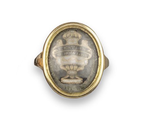 A George III gold mourning ring, with gold and enamel urn beneath inscribed the words T:Estlin M:Bowles, in glazed with mourn