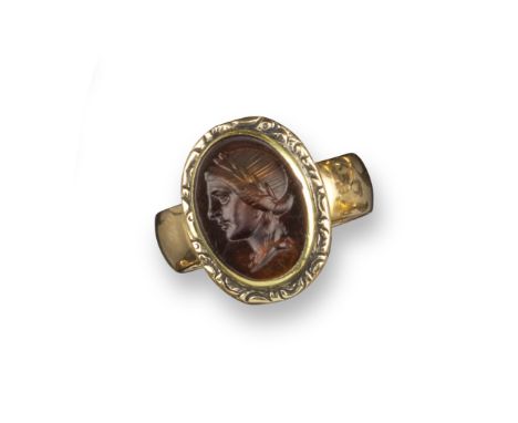 A Roman sard intaglio depicting Apollo, c1st century BC - 1st centruy AD, Apollo's head in profile and with laurels, in a 19t