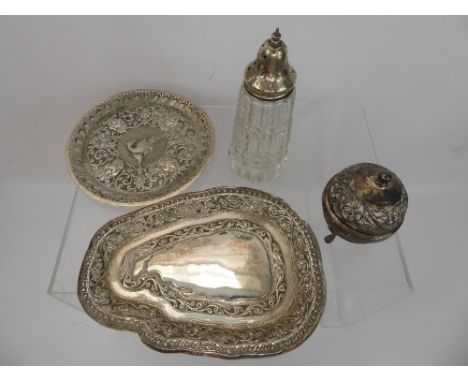 A Quantity of Indian Silver, including two trinket dishes, one small tray, a lidded pot on tripod legs and a sugar castor. (5