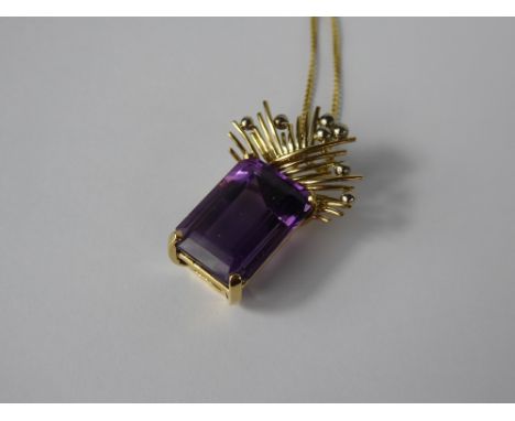 An 18 k Yellow and White Gold Hand-Crafted Bead and Wire Work Amethyst Drop Pendant, the emerald cut amethyst measuring 18 x 