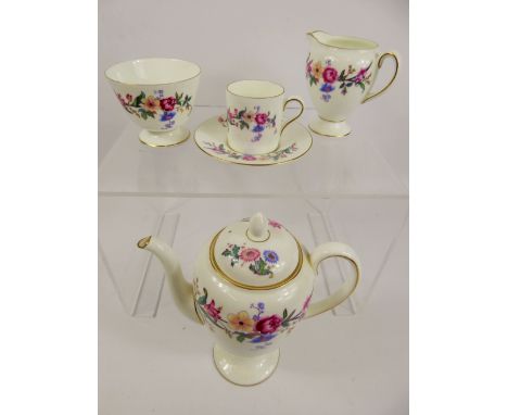 A Vintage Wedgwood 'Devon Sprays' Coffee Set, comprising coffee pot, jug, sugar bowl, six cups and saucers, two trinket dishe