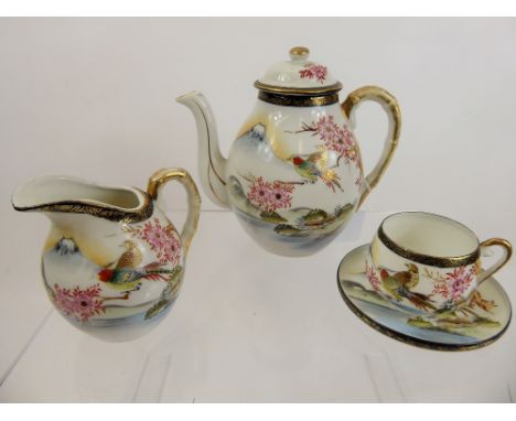 A Part Japanese Fine China Tea Set, comprising teapot, milk jug, sugar bowl, four cups and five saucers.