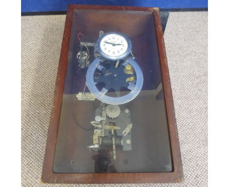 A National Time Recorder 'Clocking In' Clock, presented in a glazed mahogany frame.