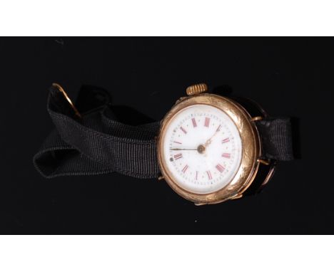 A continental ladies 14ct gold cased watch, having white enamel dial with Roman numerals, finely engraved case, and keyless m