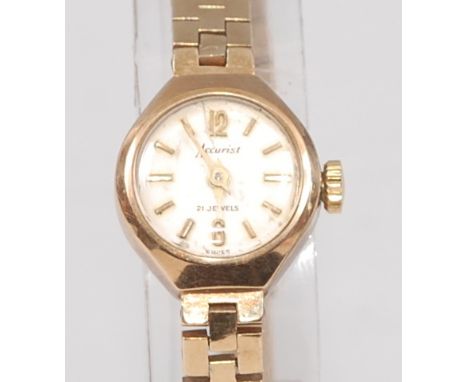 An Accurist ladies 9ct gold cased wristwatch, having signed champagne dial with baton markers, manual wind movement, and on o