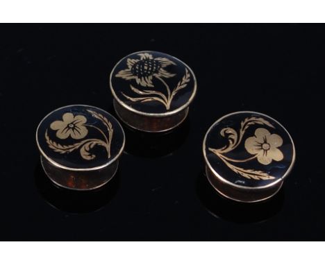 A cased set of three Victorian yellow metal and black enamel collar studs, each depicting wildflowers, in fitted case, case w