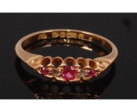 A 15ct gold, ruby and diamond ring, the diamonds each being small rough cuts, 2.4g, size N