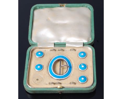 An Edwardian cased set of sterling silver and guilloche enamel dress buttons with belt buckle, each in powder blue with white