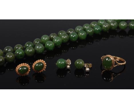 A beaded spinach jade necklace, on single knotted string, 48cm; together with a pair of matching ear studs; a 9ct gold and ca