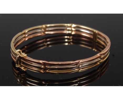 A modern 9ct three-colour gold hinged bangle, 15g, dia.6.3cm   Condition Report / Extra Information  No apparent faults.Stamp