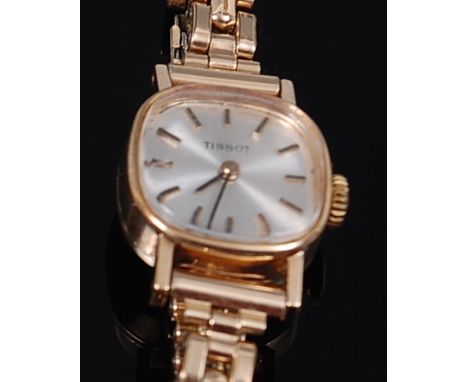 A vintage Tissot ladies 9ct gold cased bracelet watch, having signed silvered dial with baton markers, manual wind movement, 