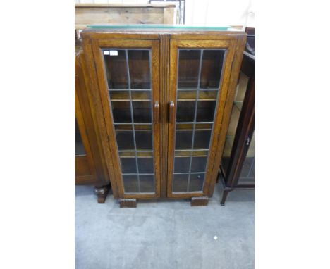 An Art Deco oak two door bookcase 