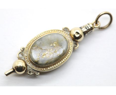 Victorian presumed 18ct gold watch key, unusually having hinged snuff compartment and set with an oval gold stone panel, 5.8g