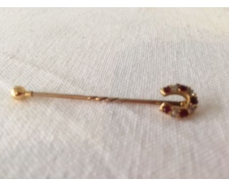 A Gold Pin Broach with Ruby and Pearl Horseshoe