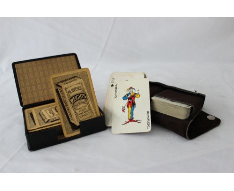 A set of vintage playing cards (Players Weights" and 2 sets of vintage playing cards in a suede case
