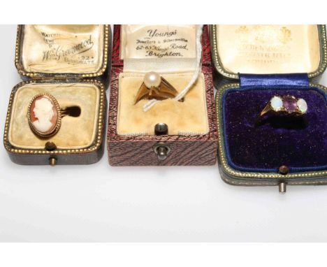 Three 9 carat gold rings, pearl, cameo and amethyst with opal