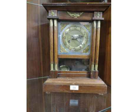 A VINTAGE MANTEL CLOCK WITH PENDULUM 