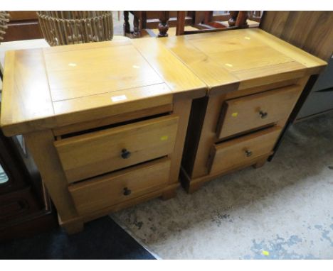 A PAIR OF LIGHT OAK BEDSIDE CHESTS