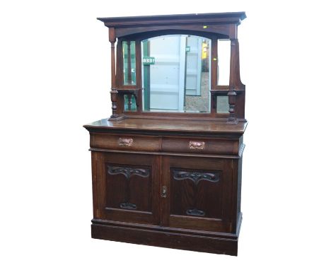 Oak Art Nouveau Mirror backed Dresser with bevel edged mirror over Hammered copper drop handles and carved panel doors. 122cm